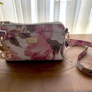 Pink and white floral Guess bag with 3 pockets.